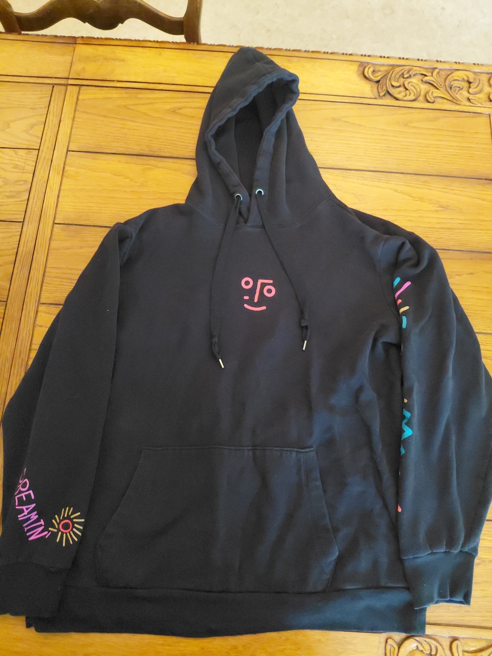 No Boundaries Black Hoodie with Pink Face Graphic and Multicolor Sleeve Accents